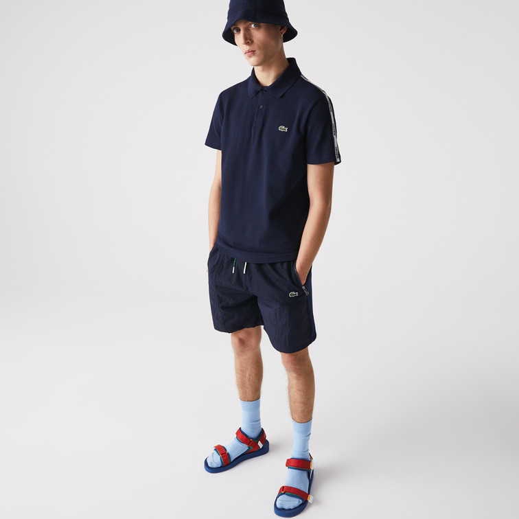 POLO CON FRANJAS ESTAMPADAS HOMBRE LACOSTE