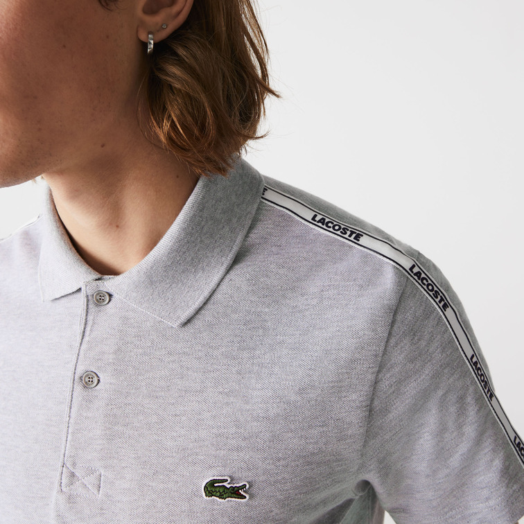 POLO CON FRANJAS ESTAMPADAS HOMBRE LACOSTE