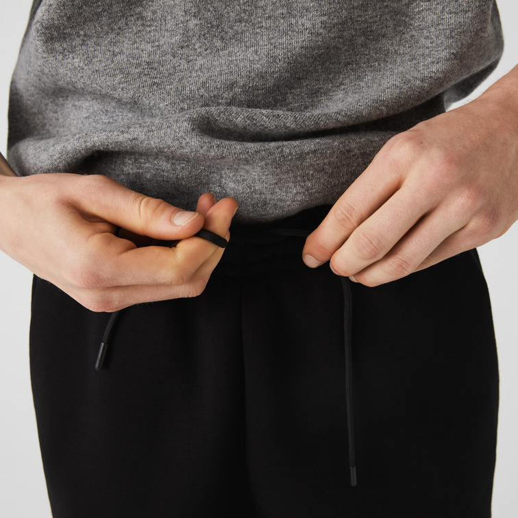 PANTALÓN DE CHÁNDAL CON FRANJAS ESTAMPADAS HOMBRE LACOSTE