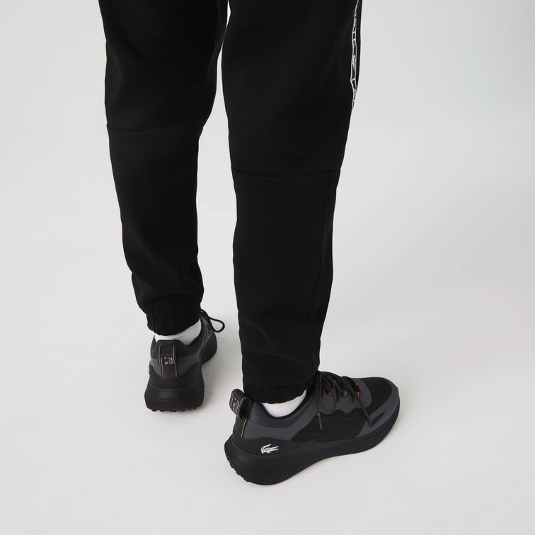 PANTALÓN DE CHÁNDAL CON FRANJAS ESTAMPADAS HOMBRE LACOSTE
