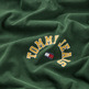 CAMISETA CLÁSICA CON LOGO COLLEGE CURVADO HOMBRE TOMMY JEANS