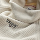 JERSEY DE PUNTO ELÁSTICO CON CUELLO CISNE MUJER TOMMY JEANS