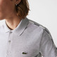 POLO CON FRANJAS ESTAMPADAS HOMBRE LACOSTE