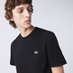 CAMISETA CON FRANJAS CON INSCRIPCIÓN HOMBRE LACOSTE